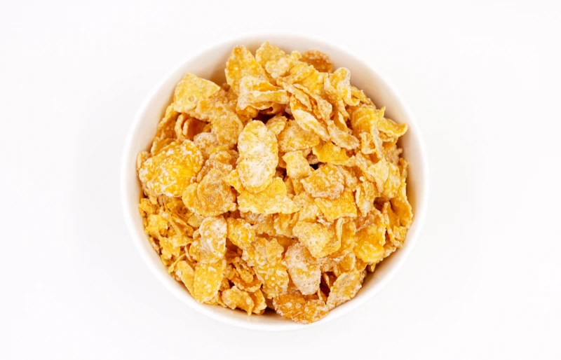 frosted flakes or sugar-coated flakes breakfast cereal in a bowl