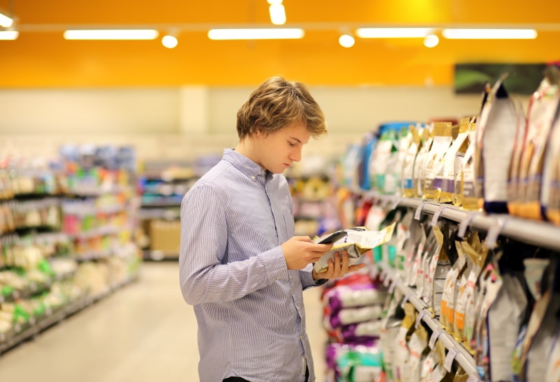 man buying pet food