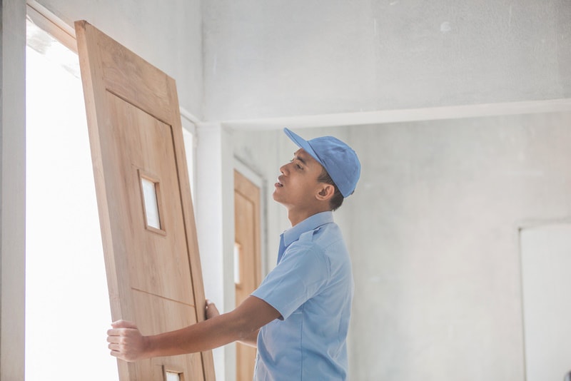 man checking wooden door