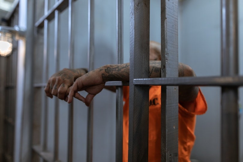 man in a prison cell
