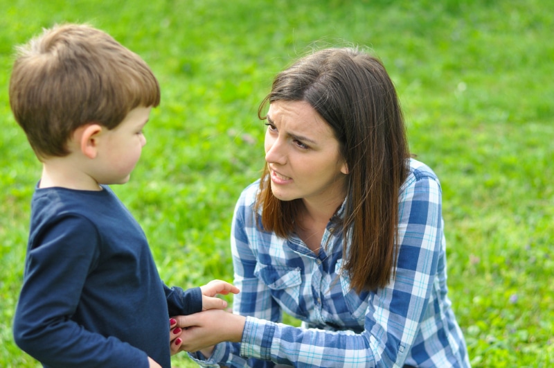 mother talking to her son at the park