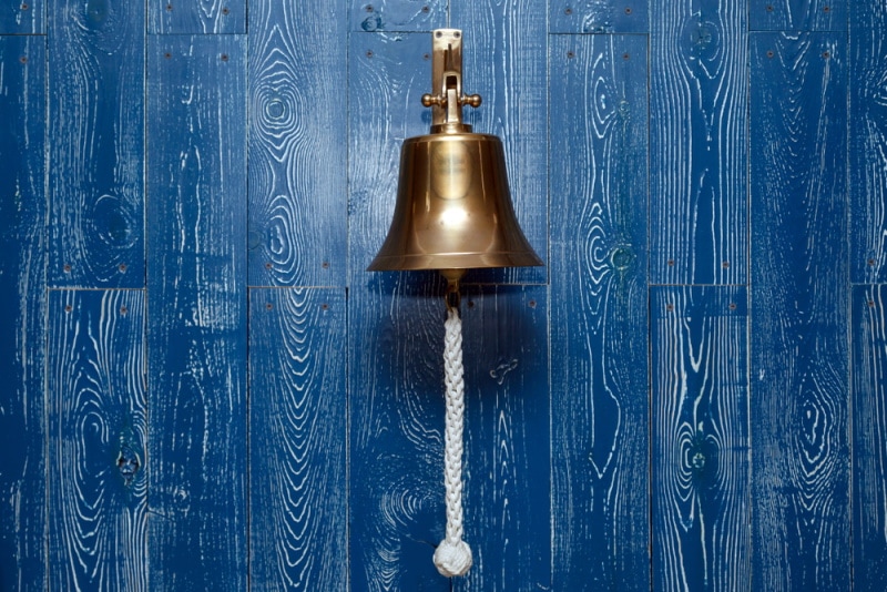 old door bell hanging on the door