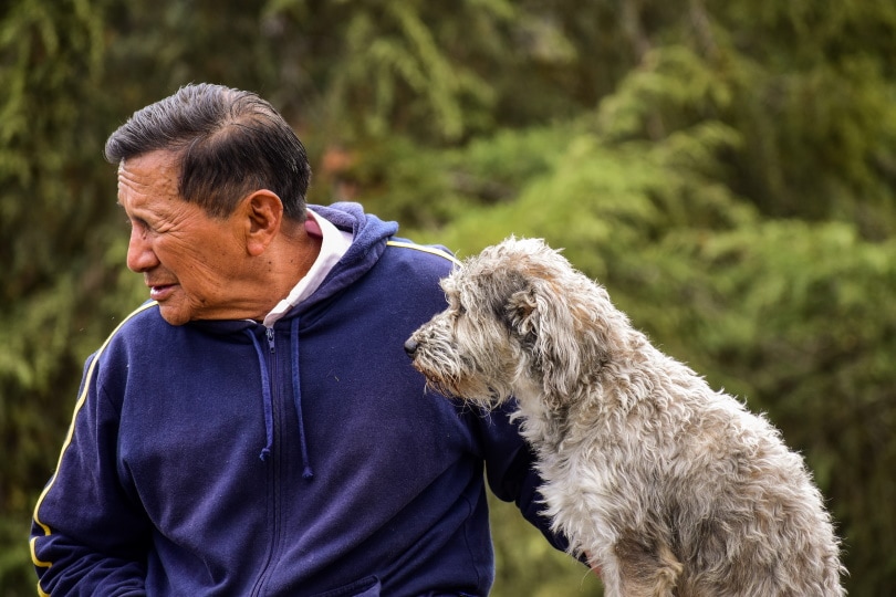pet owner and his dog in the park