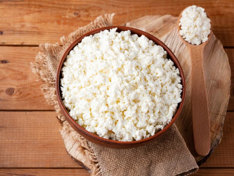 Cottage cheese on a wooden stand