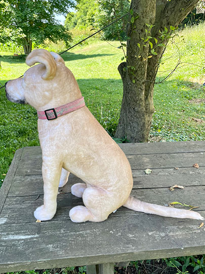 side view of the cuddle clone plush dog