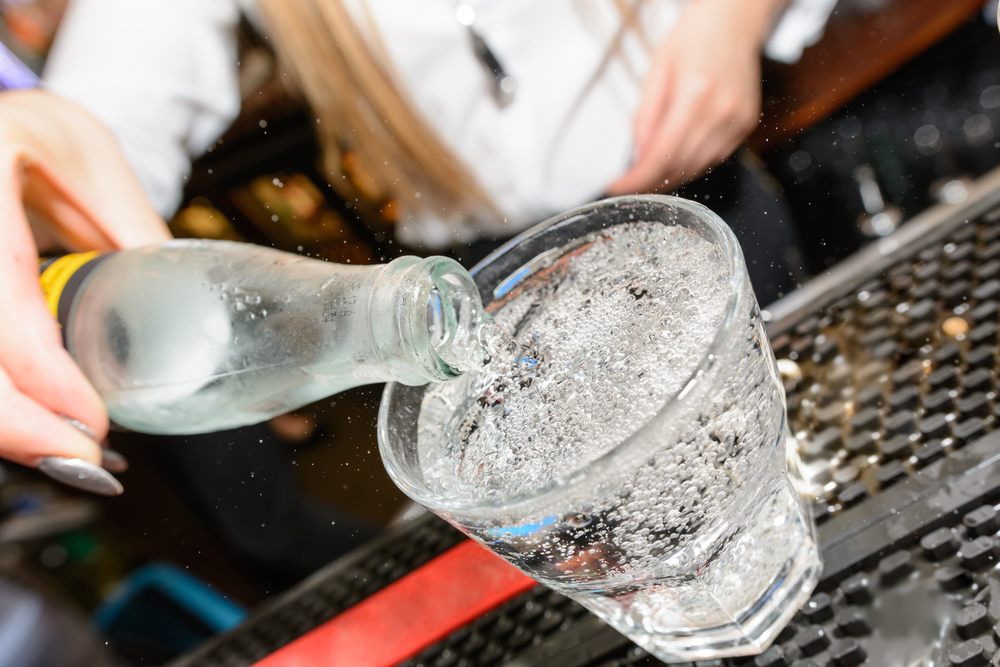 soda being poured in glass