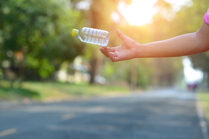 tossing water bottle