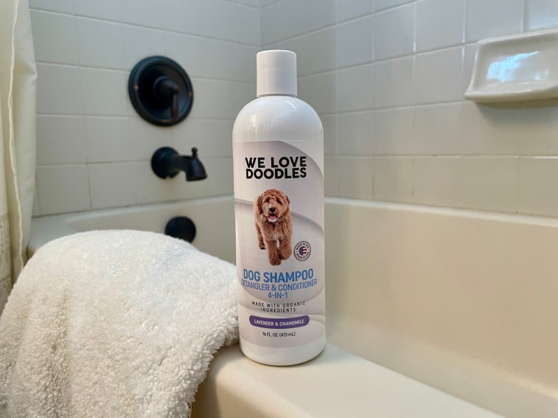 we love doodles shampoo bottle on the bathtub