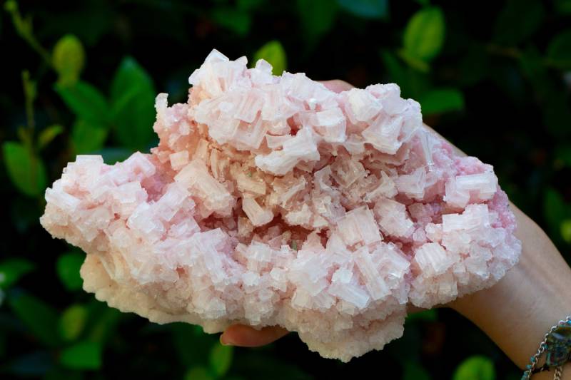 woman holding halite mineral rock stone