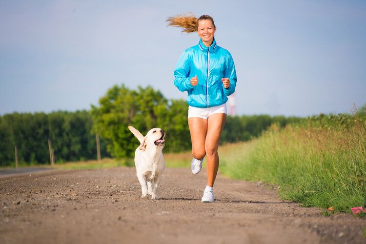 woman running with dog