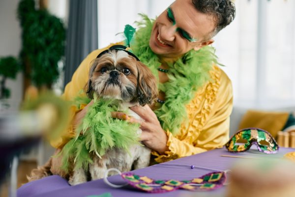 owner and dog dressed for mardi gras