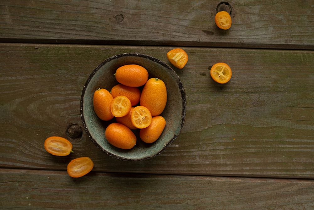 a bowl of kumquats