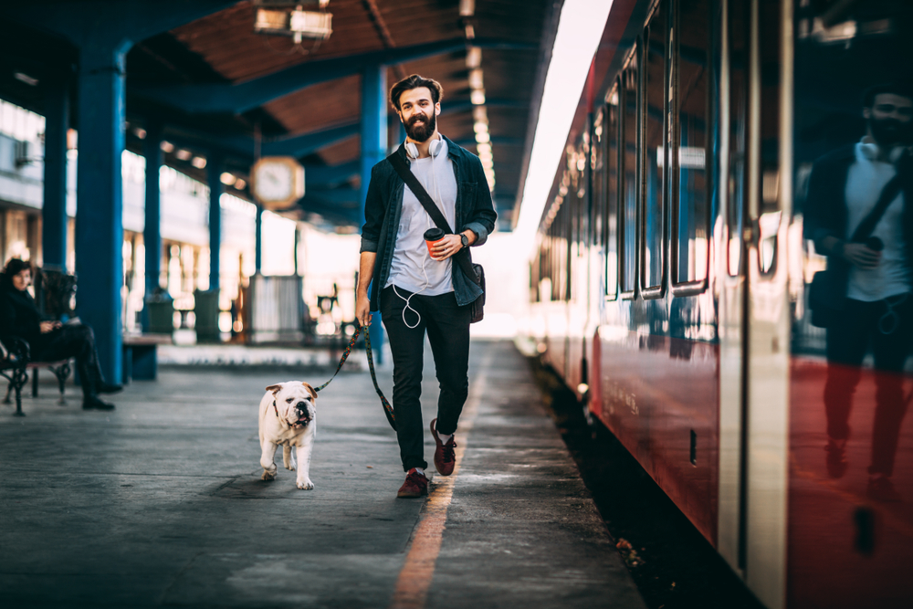 man-and-his-dog-at-the-train-station