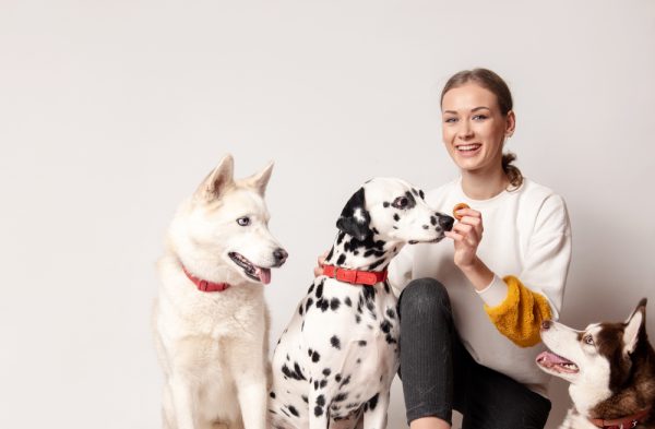 woman among her three dogs