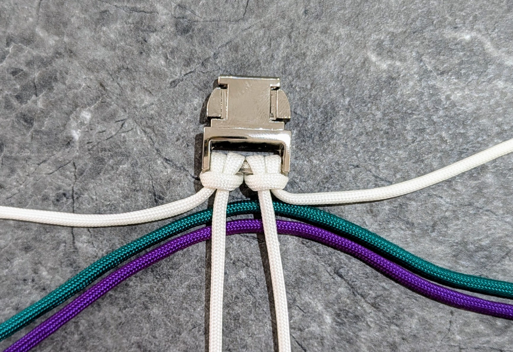 13. Find the midway point of the other two colors and place them behind the middle cords