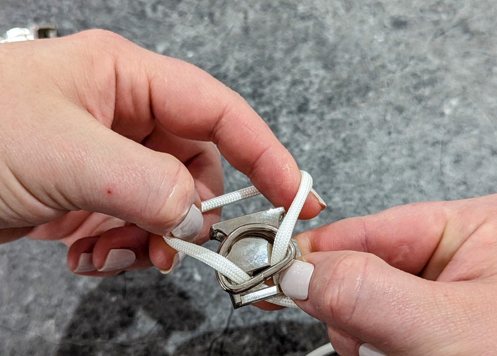 2. Loop it over the end of the buckle then pull into place