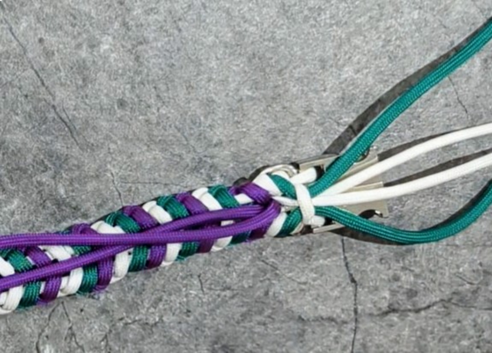 23. Now pull color 3 through the gap, but not through the loop with color 1 & 2