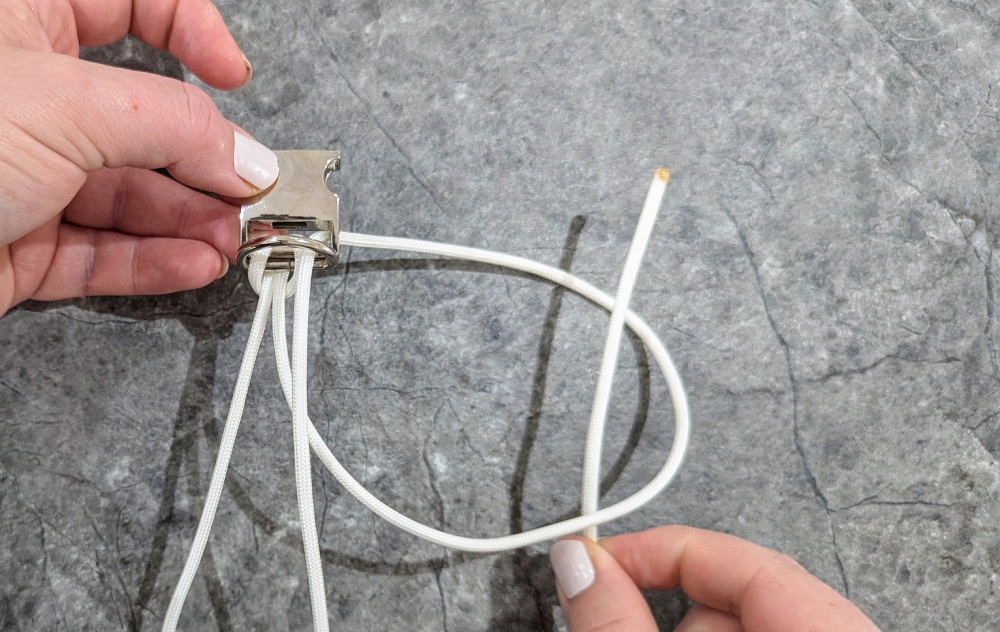 5. Then thread the end through the loop made, and pull it tight