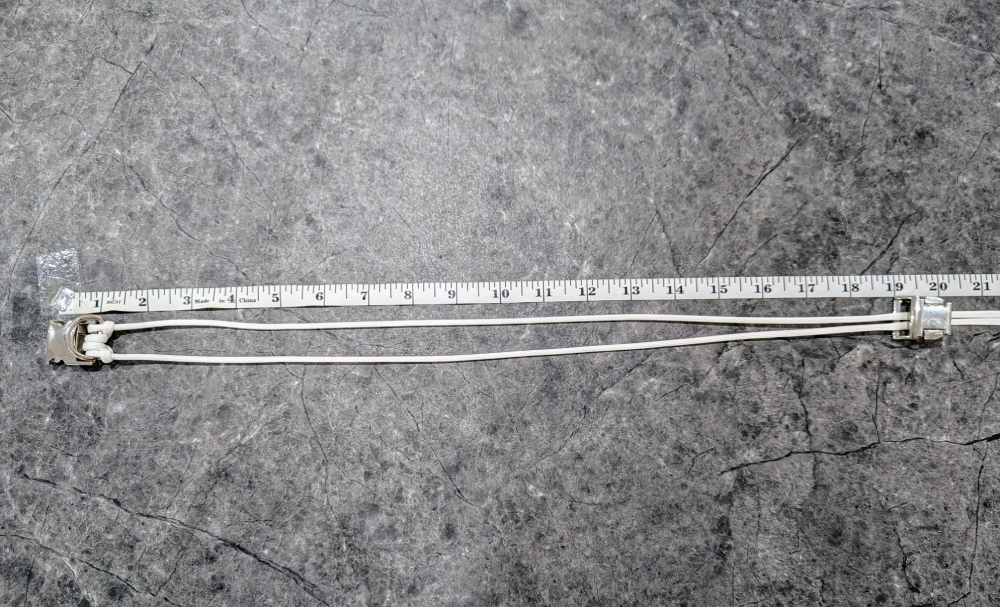 8. Thread the ends of your cord through the FRONT of the other piece of the buckle and measure your collar length