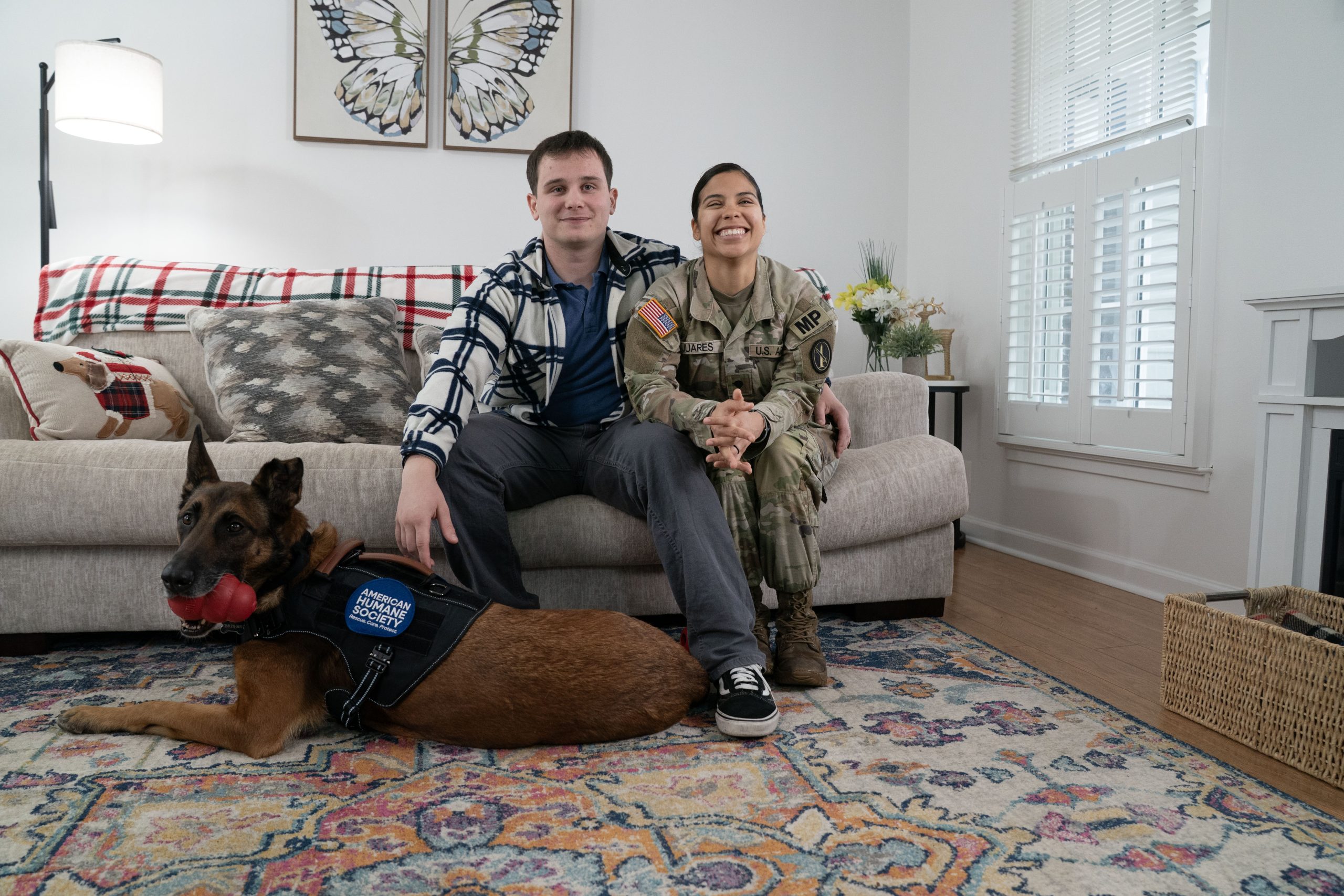 Military Dog Reunites with Handler and Retires on U.S. Soil - Darco with Kellee and her husband_American Humane Society